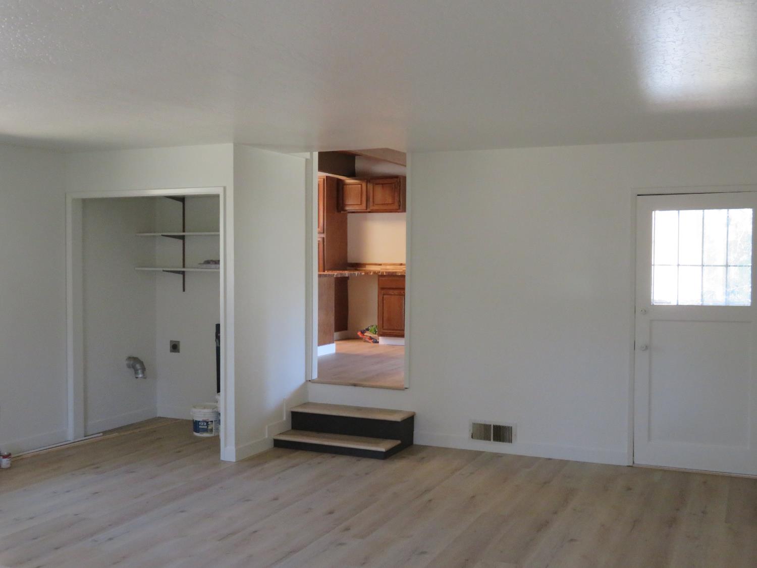 190 Bald Mountain Road West Point, CA 95255 - Photo 23 of 48 an empty room with wooden floor and windows