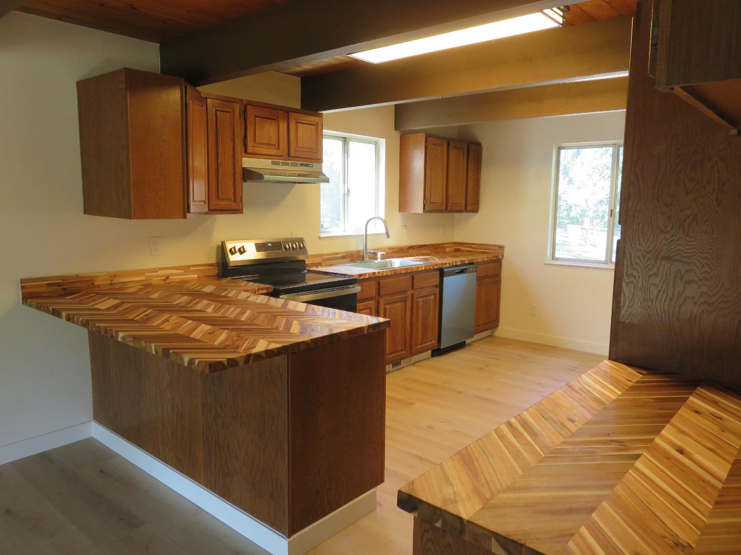 190 Bald Mountain Road West Point, CA 95255 - Photo 41 of 48 a kitchen with stainless steel appliances granite countertop a sink stove and cabinets