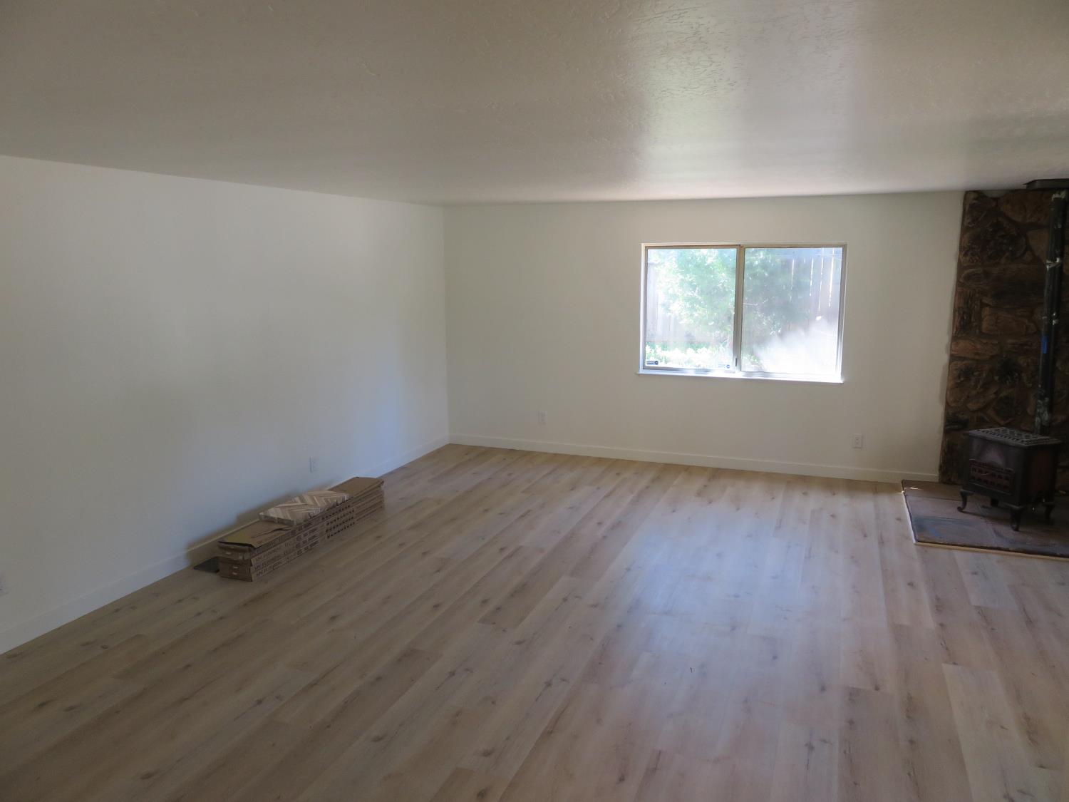 190 Bald Mountain Road West Point, CA 95255 - Photo 43 of 48 wooden floor in an empty room with a window