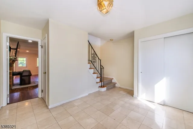 a view of an entryway with wooden floor
