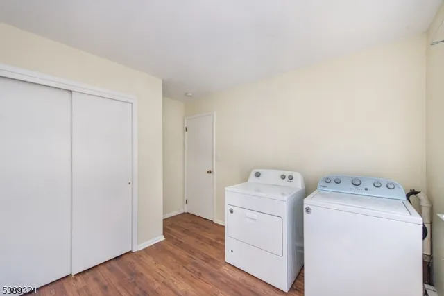 a view of storage and utility room with washer and dryer