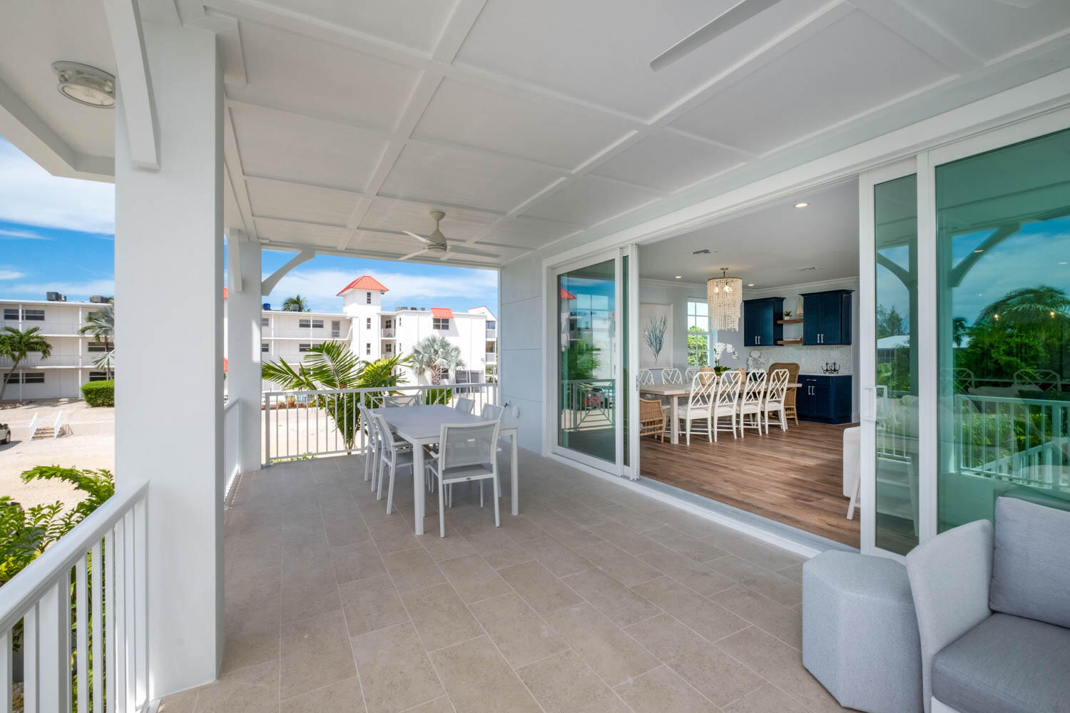 611 Sombrero Beach Road Marathon, FL 33050 - Photo 26 of 51 a dining room with furniture and a floor to ceiling window