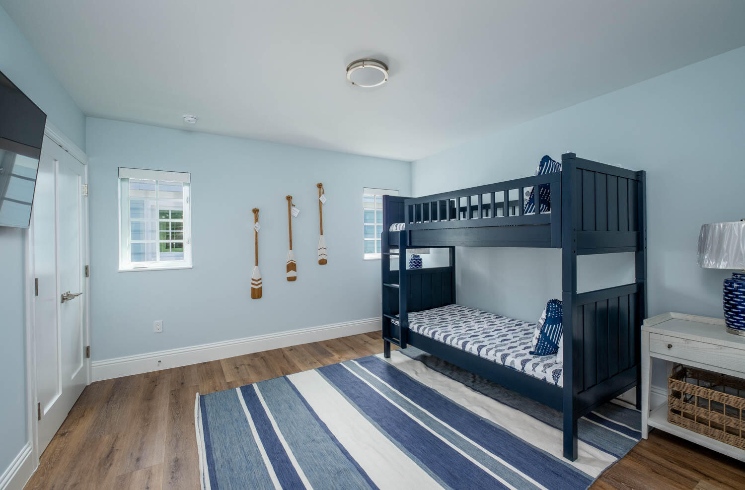 611 Sombrero Beach Road Marathon, FL 33050 - Photo 43 of 51 a bedroom with a bed and wooden floor