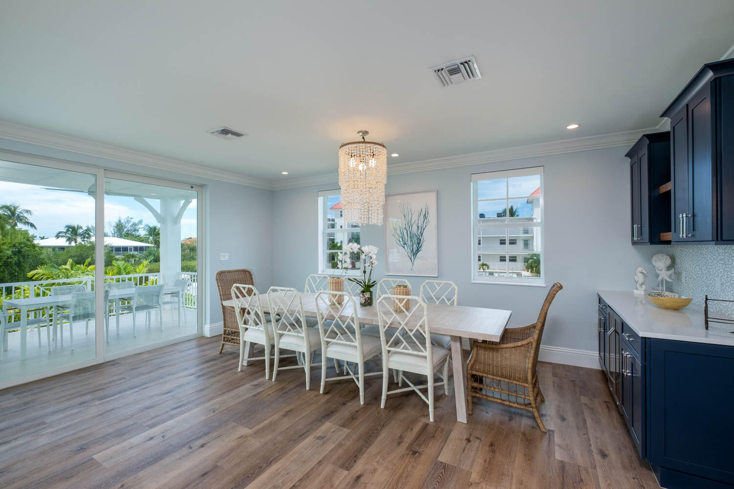 611 Sombrero Beach Road Marathon, FL 33050 - Photo 8 of 51 a view of a dining room with furniture window and wooden floor