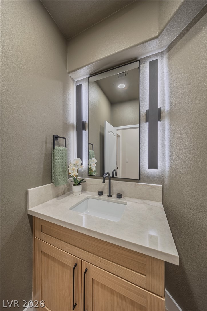 8800 Lusso Las Vegas, NV 89134 - Photo 58 of 85 Bathroom featuring a textured wall and vanity