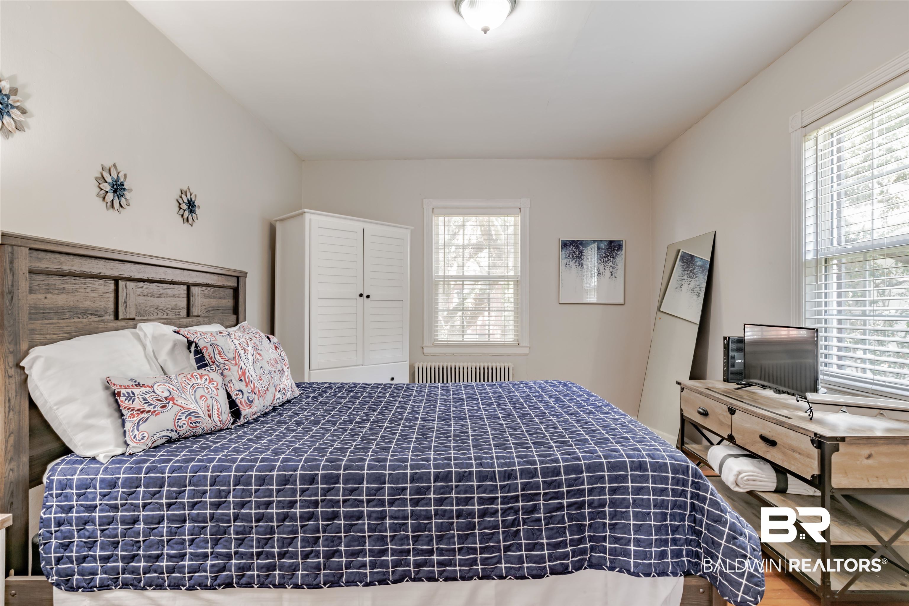 214 Upham Street, Unit 7C Mobile, AL 36607 - Photo 16 of 32 Bedroom with radiator heating unit and wood finished floors