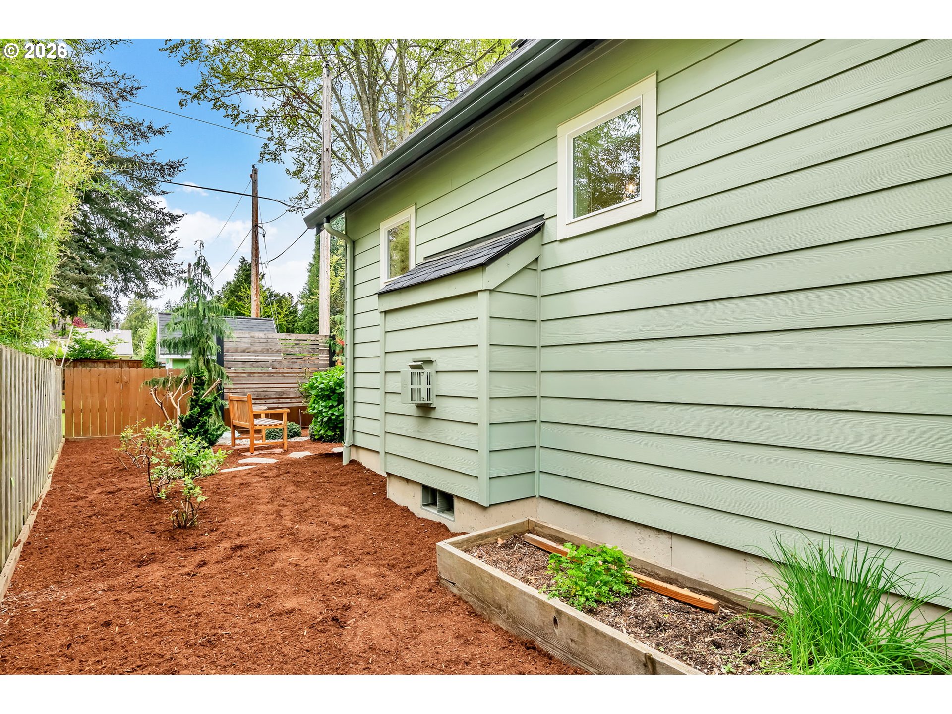 444 Emily Lane Eugene, OR 97404 - Photo 43 of 47 a view of a backyard with a chair under an umbrella