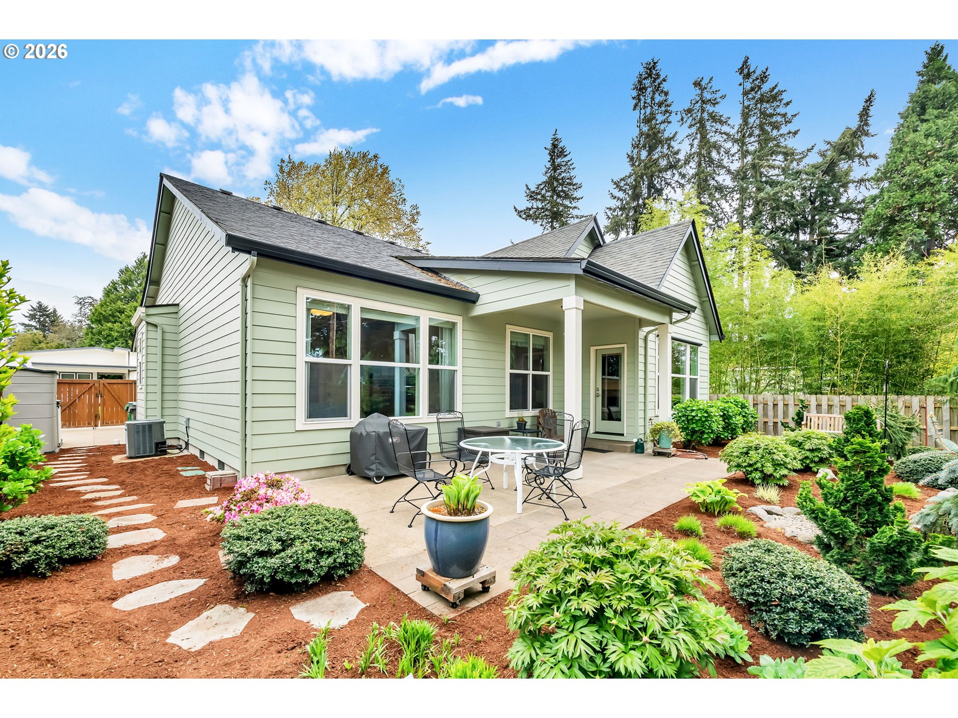 444 Emily Lane Eugene, OR 97404 - Photo 46 of 47 a front view of a house with sitting area and garden