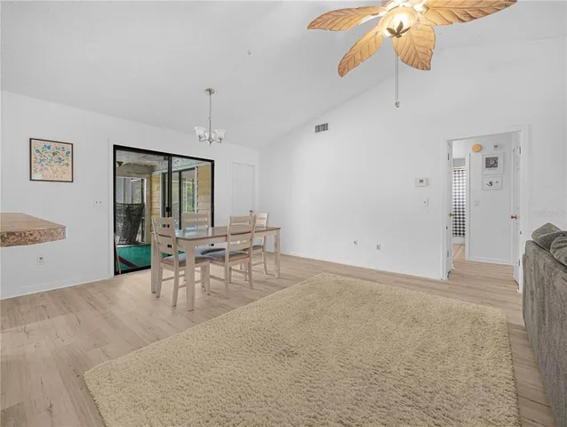a view of a livingroom with furniture and chandelier