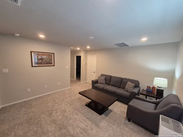 a living room with furniture and a couch