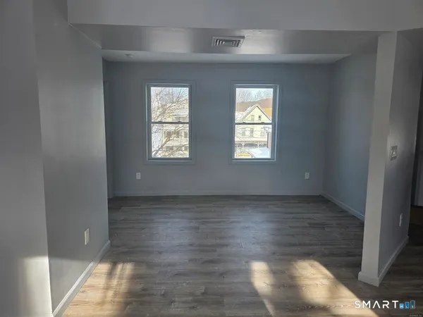 a view of an empty room and window