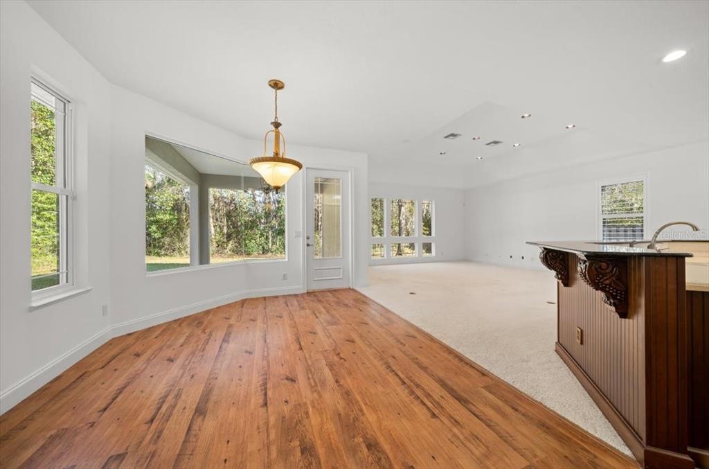 4929 Southwest 2nd Court Ocala, FL 34471 - Photo 12 of 60 a view of empty room with window and wooden floor