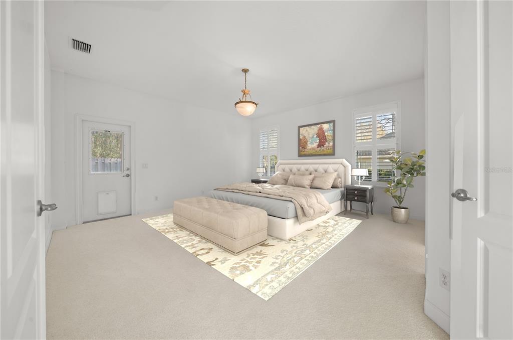 4929 Southwest 2nd Court Ocala, FL 34471 - Photo 20 of 60 a bedroom with a bed and a couch