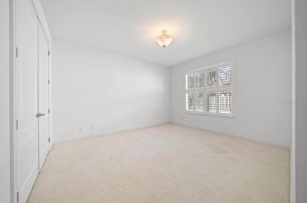 4929 Southwest 2nd Court Ocala, FL 34471 - Photo 34 of 60 an empty room with windows and chandelier fan