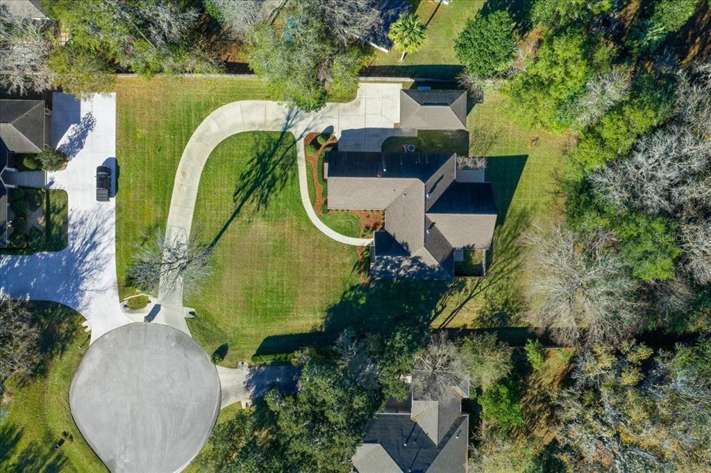 4929 Southwest 2nd Court Ocala, FL 34471 - Photo 49 of 60 an aerial view of a house with swimming pool and garden