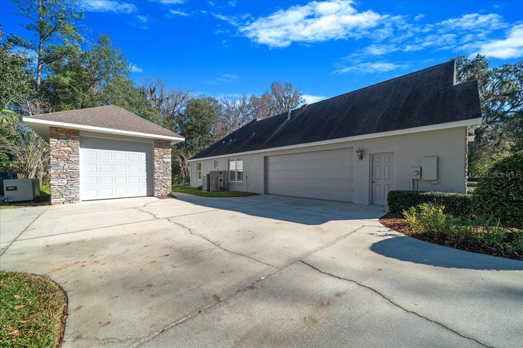 4929 Southwest 2nd Court Ocala, FL 34471 - Photo 54 of 60 a front view of a house with a yard and garage