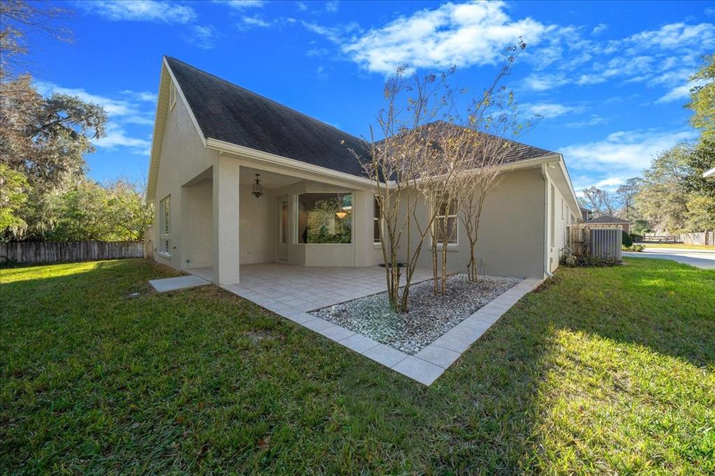 4929 Southwest 2nd Court Ocala, FL 34471 - Photo 58 of 60 a front view of a house with a yard