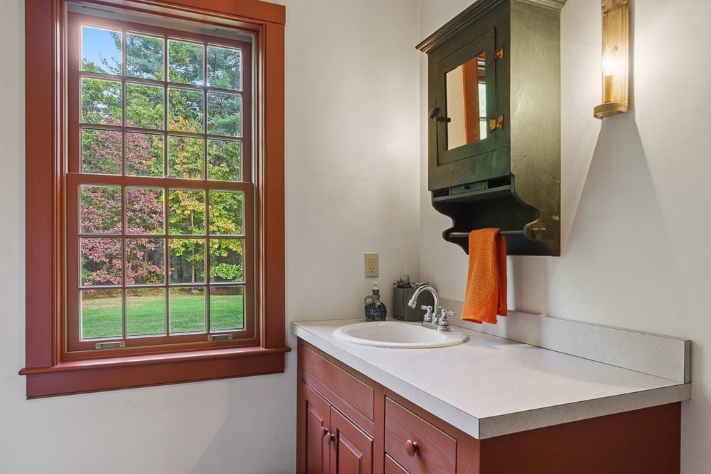 88 Bullard Road Princeton, MA 01541 - Photo 19 of 41 a bathroom with a sink and a mirror