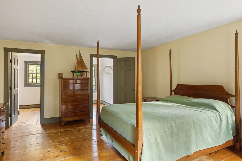 88 Bullard Road Princeton, MA 01541 - Photo 26 of 41 a bedroom with a bed and wooden floor