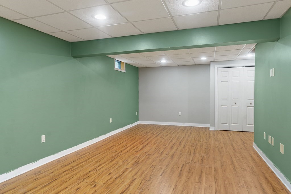 88 Bullard Road Princeton, MA 01541 - Photo 33 of 41 an empty room with wooden floor and closet