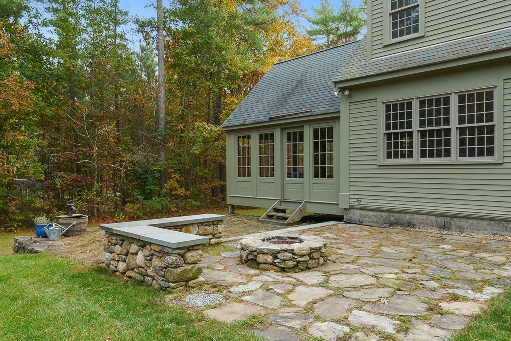 88 Bullard Road Princeton, MA 01541 - Photo 36 of 41 a backyard of a house with table and chairs