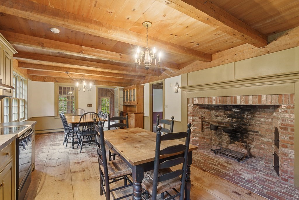 88 Bullard Road Princeton, MA 01541 - Photo 6 of 41 a dining room with furniture a chandelier and wooden floor