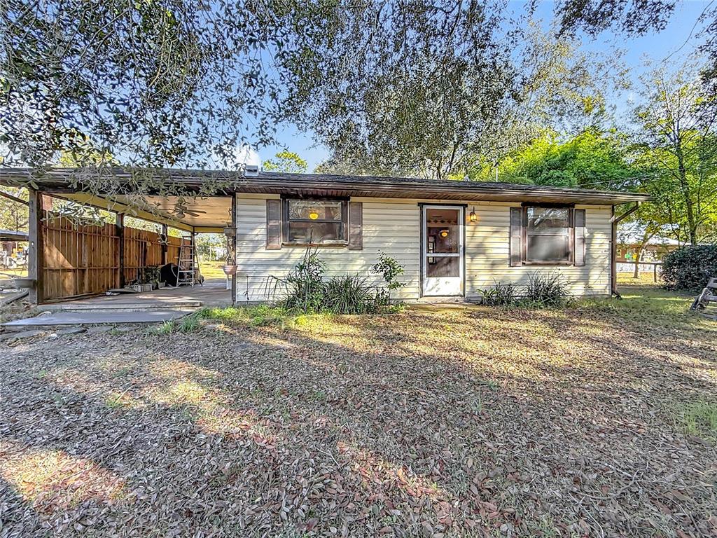3175 Southwest 181st Court Dunnellon, FL 34432 - Photo 1 of 35 a view of a yard in front of a house