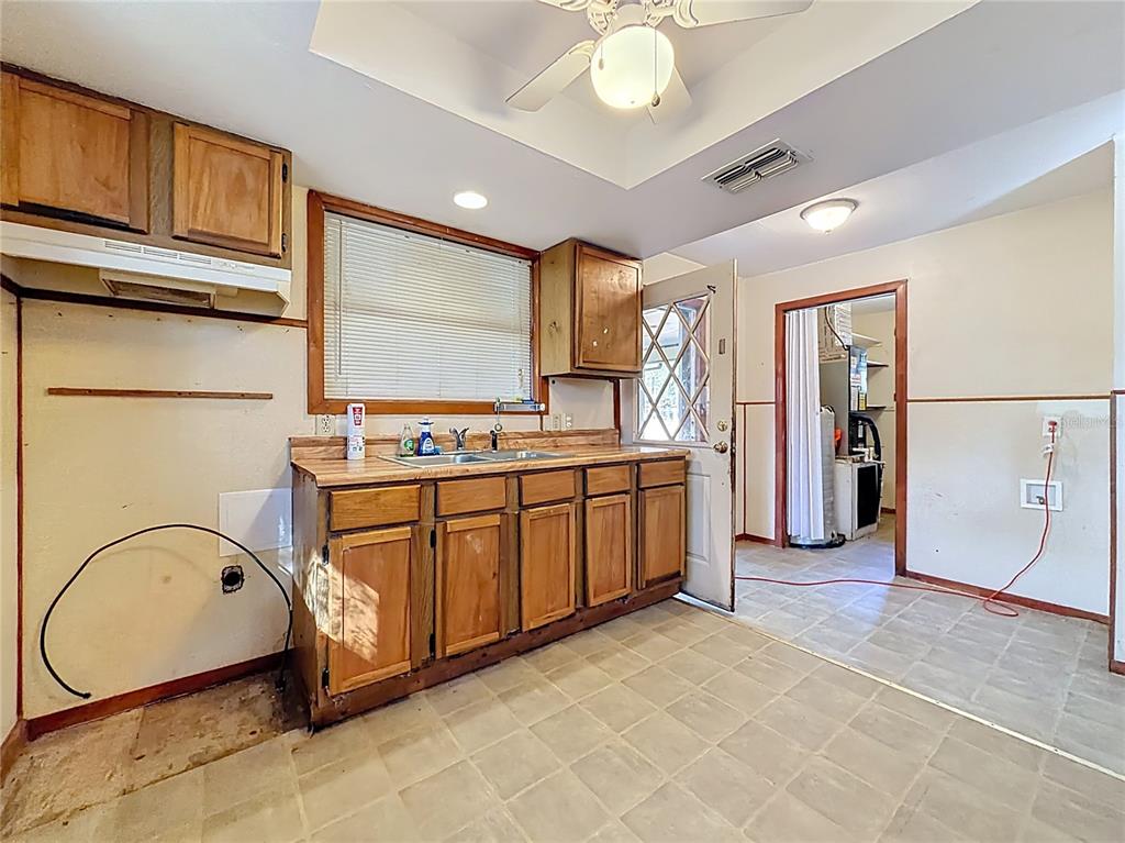 3175 Southwest 181st Court Dunnellon, FL 34432 - Photo 11 of 35 a view of cabinets a refrigerator and a sink