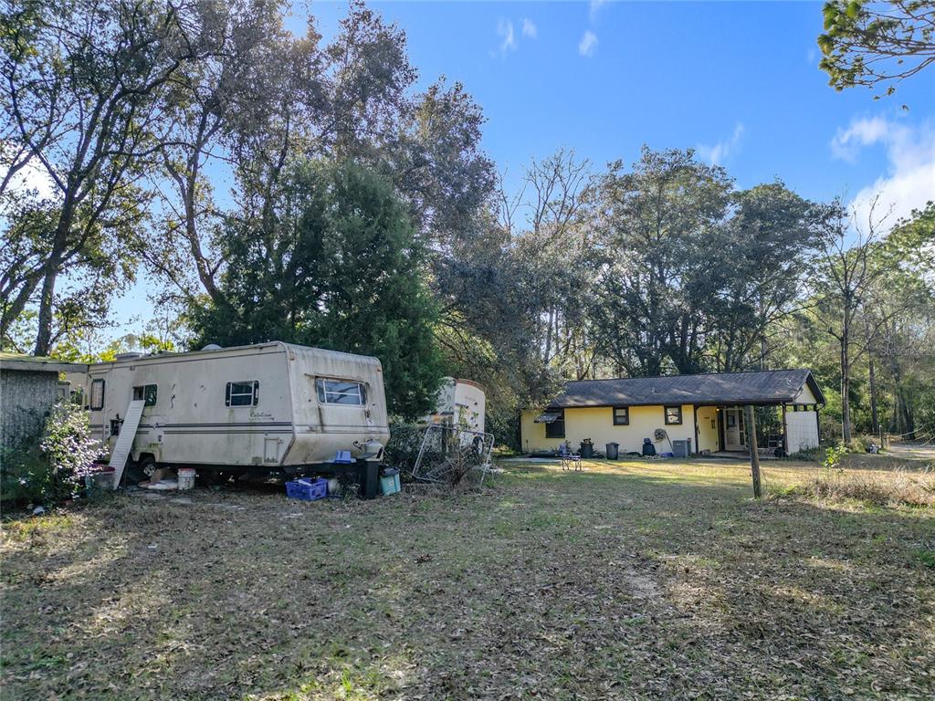 3175 Southwest 181st Court Dunnellon, FL 34432 - Photo 28 of 35 a front view of a house with garden