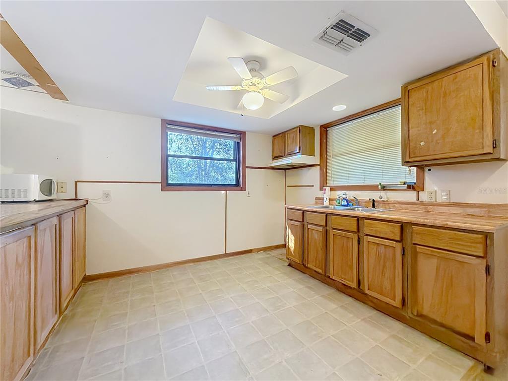 3175 Southwest 181st Court Dunnellon, FL 34432 - Photo 10 of 35 a spacious bathroom with a granite countertop sink a mirror and a