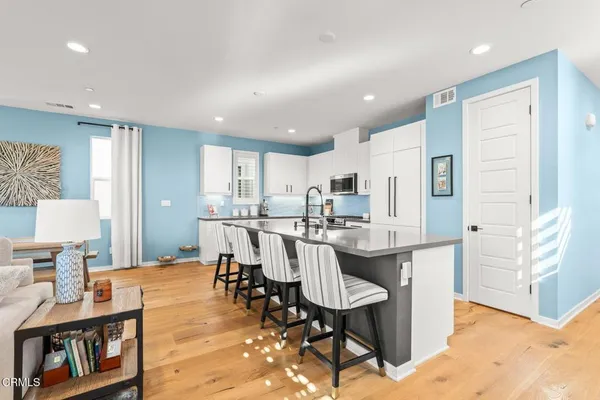 a view of a kitchen and dining room