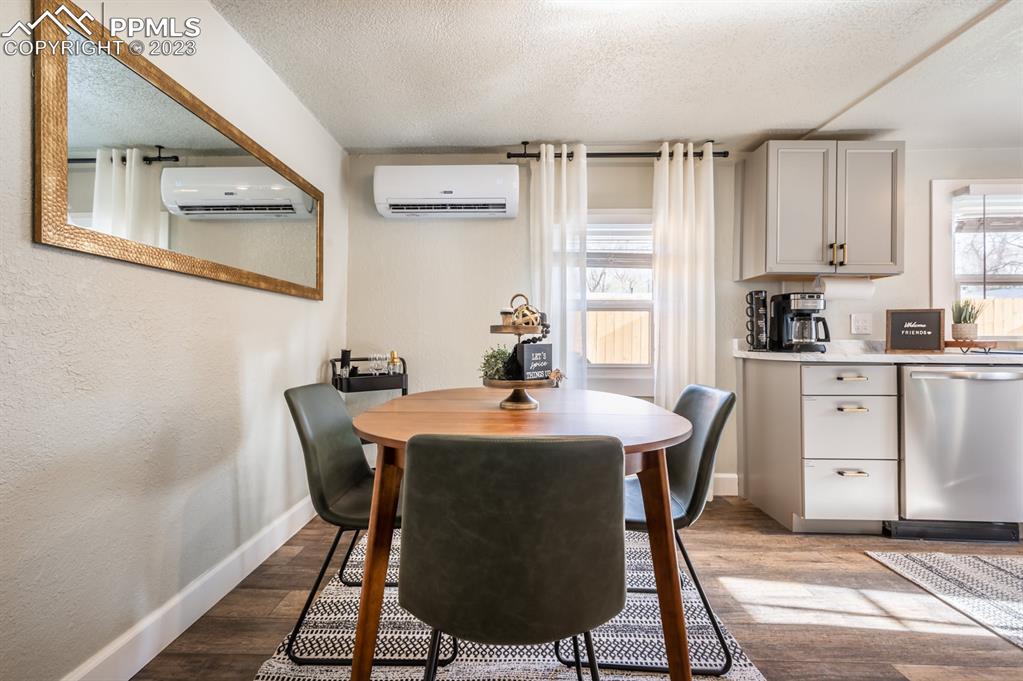 627 Alexander Road Colorado Springs, CO 80909 - Photo 11 of 40 a dining room with furniture and window