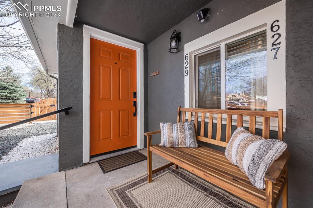 627 Alexander Road Colorado Springs, CO 80909 - Photo 22 of 40 a view of a balcony with wooden floor