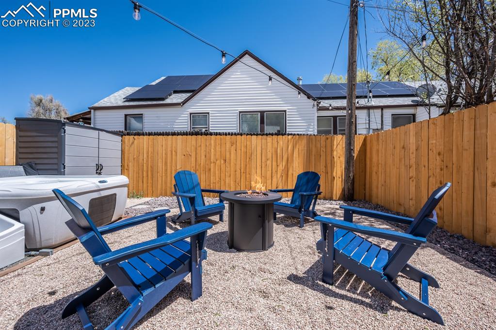 627 Alexander Road Colorado Springs, CO 80909 - Photo 38 of 40 a view of a chairs and table in the patio