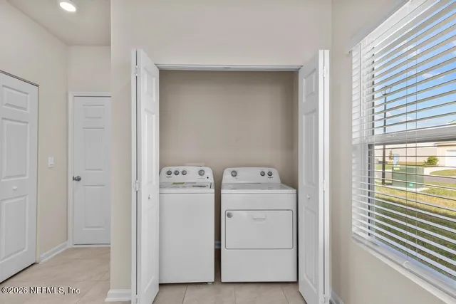a utility room with dryer and washer