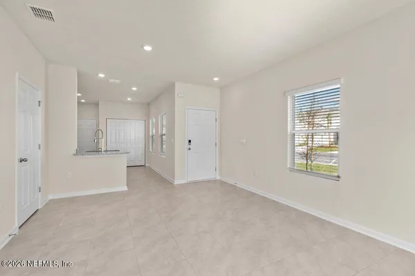 a view of an empty room with a window