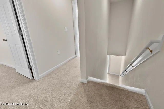 a view of a hallway with staircase