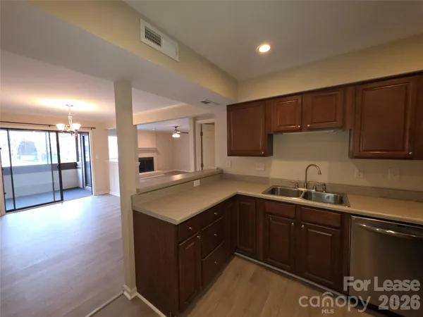 a kitchen with a sink and cabinets