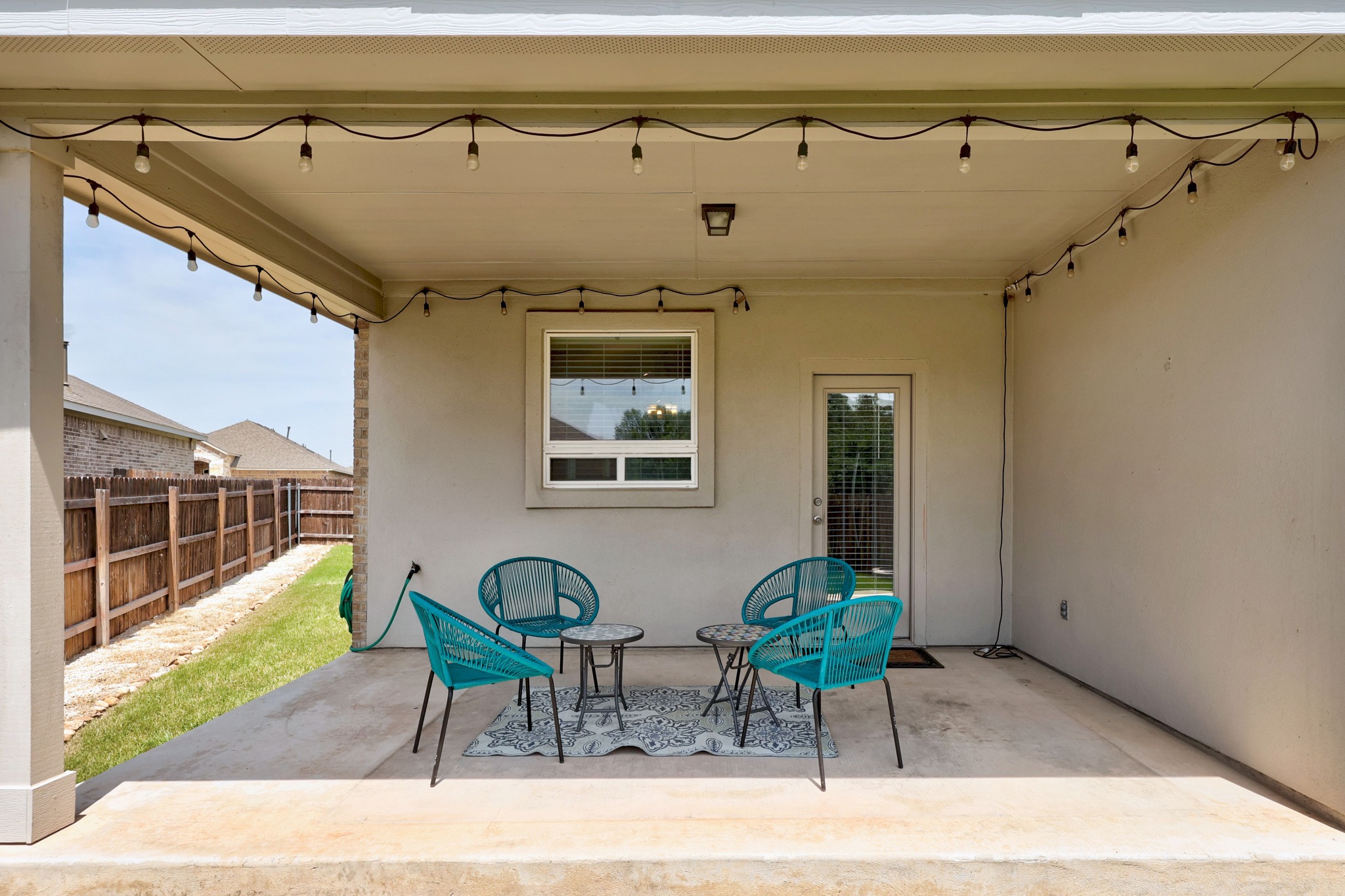2413 Starhill Ranch Street Georgetown, TX 78628 - Photo 32 of 40 a couple of chairs sitting in front of a door