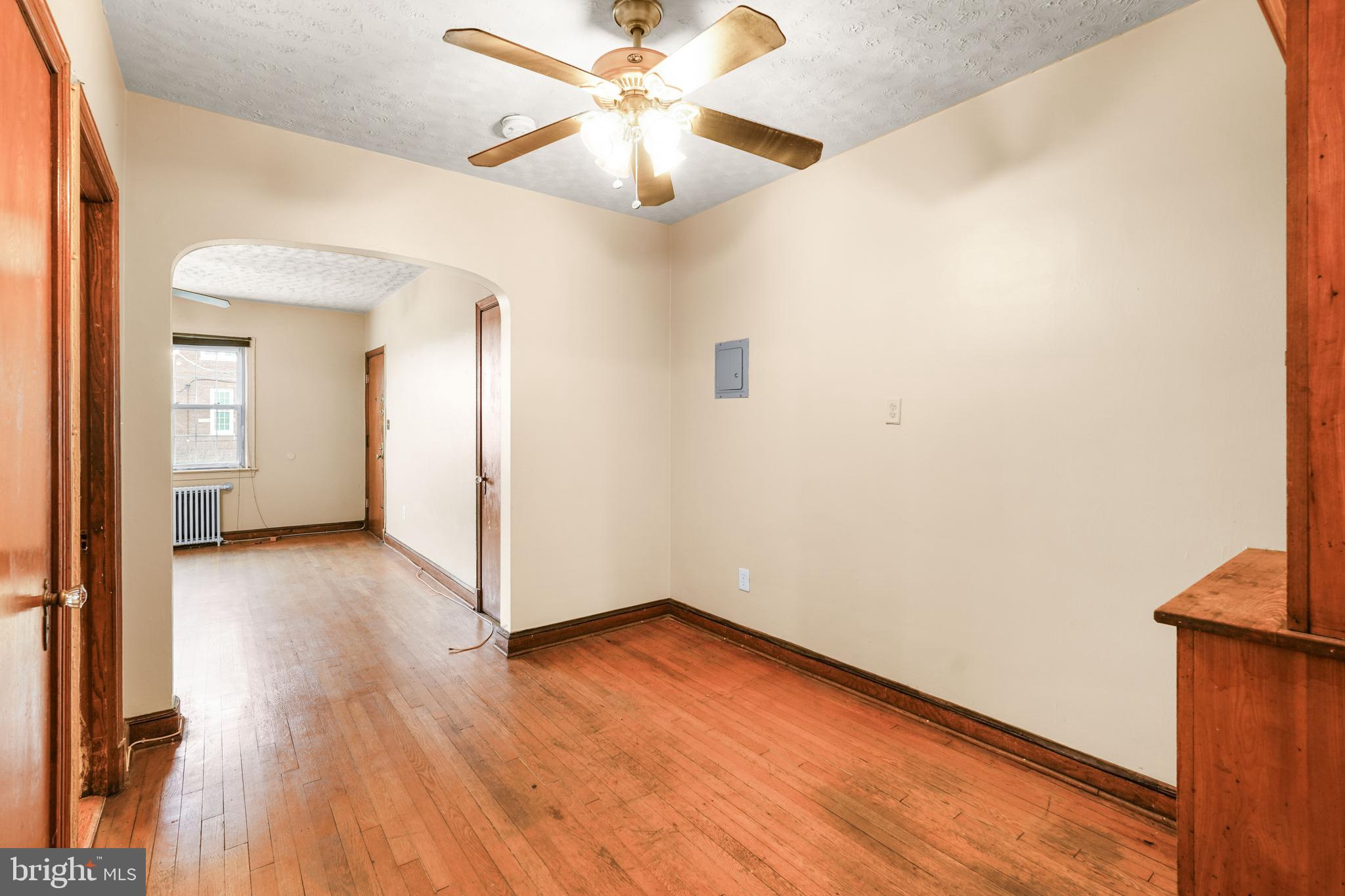 1515 17th Street Southeast Washington, DC 20020 - Photo 10 of 16 a view of a room with wooden floor and a ceiling fan