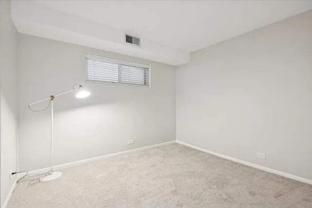 an empty room with a empty space and window