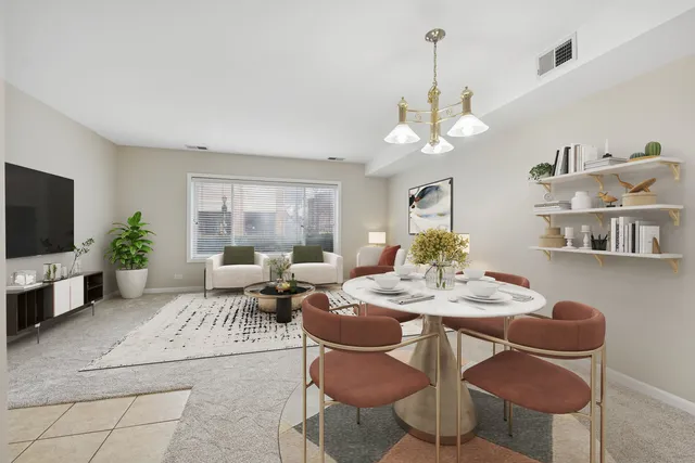 a living room with furniture a chandelier and a flat screen tv