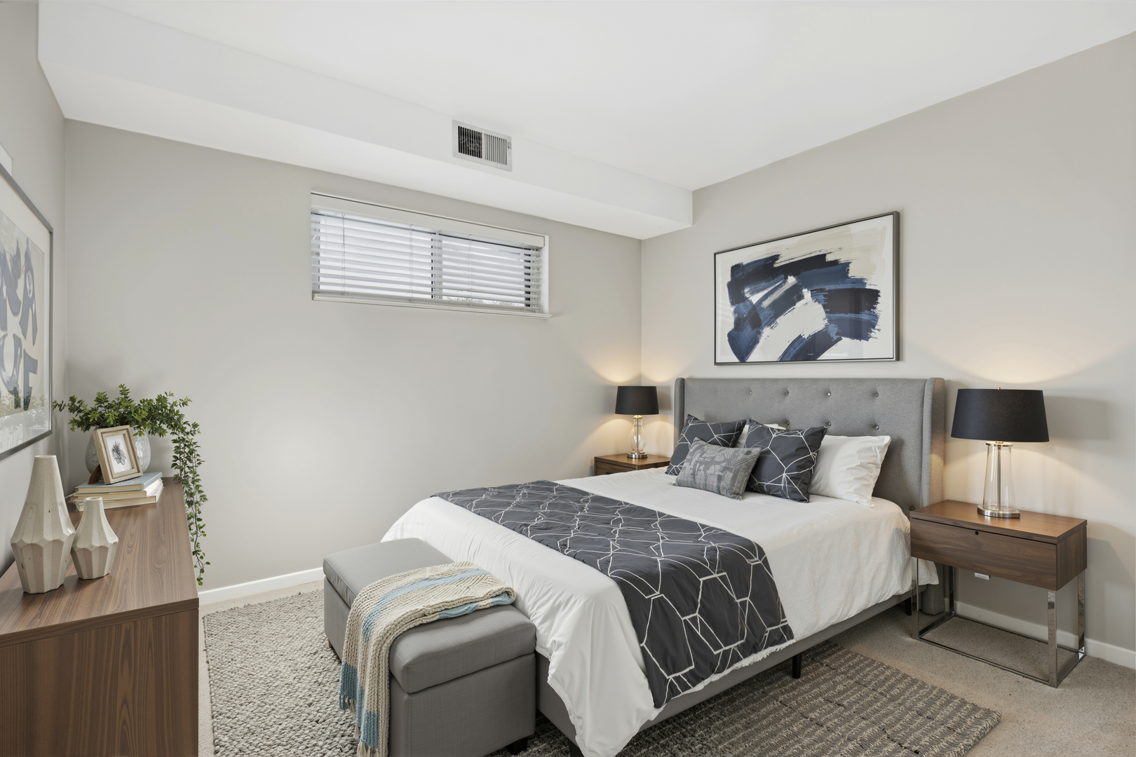 7320 Lake Street, Unit 1A River Forest, IL 60305 - Photo 5 of 22 a bedroom with a bed and a painting on the wall