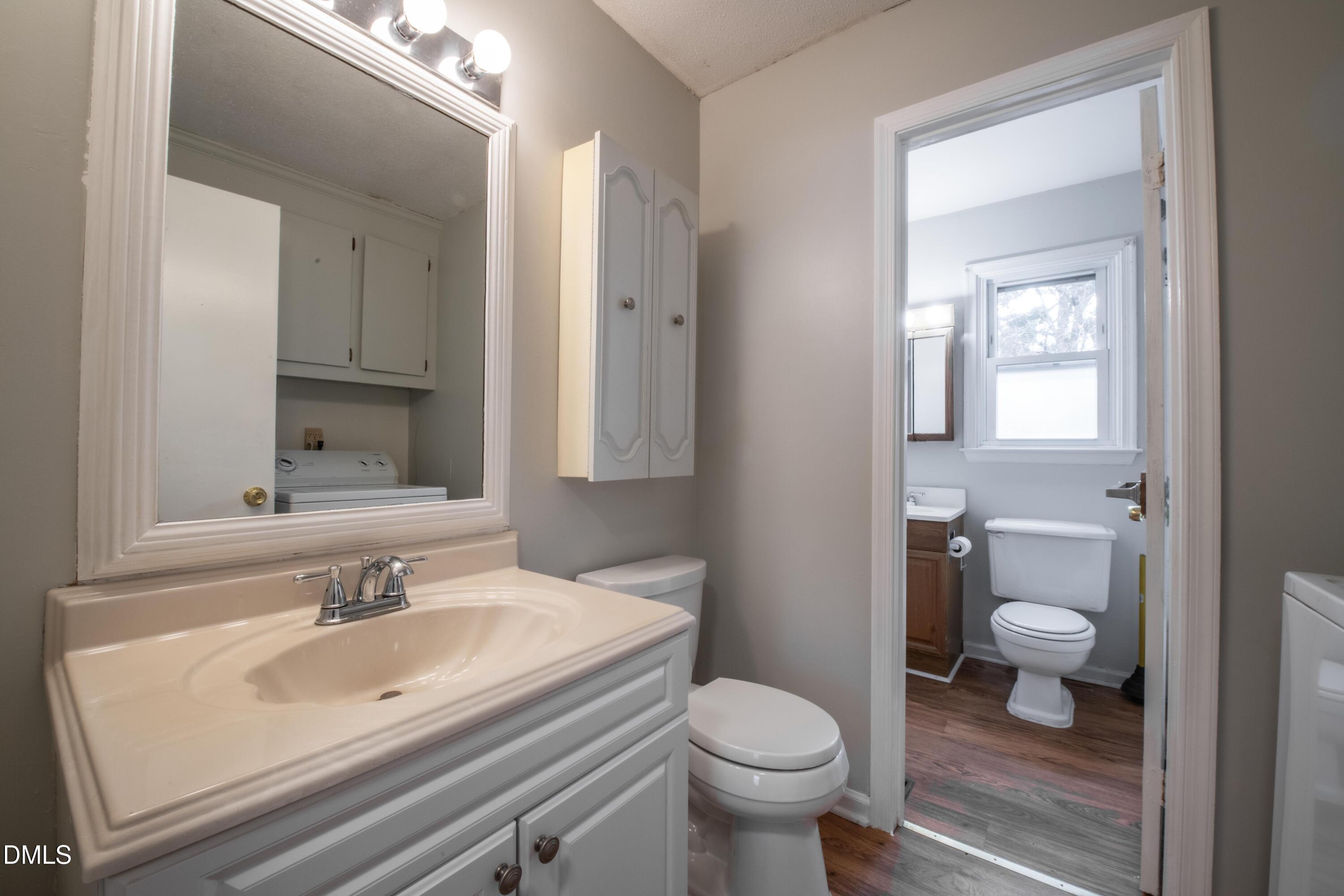 116 East Judd Street Zebulon, NC 27597 - Photo 11 of 21 a bathroom with a sink toilet and shower