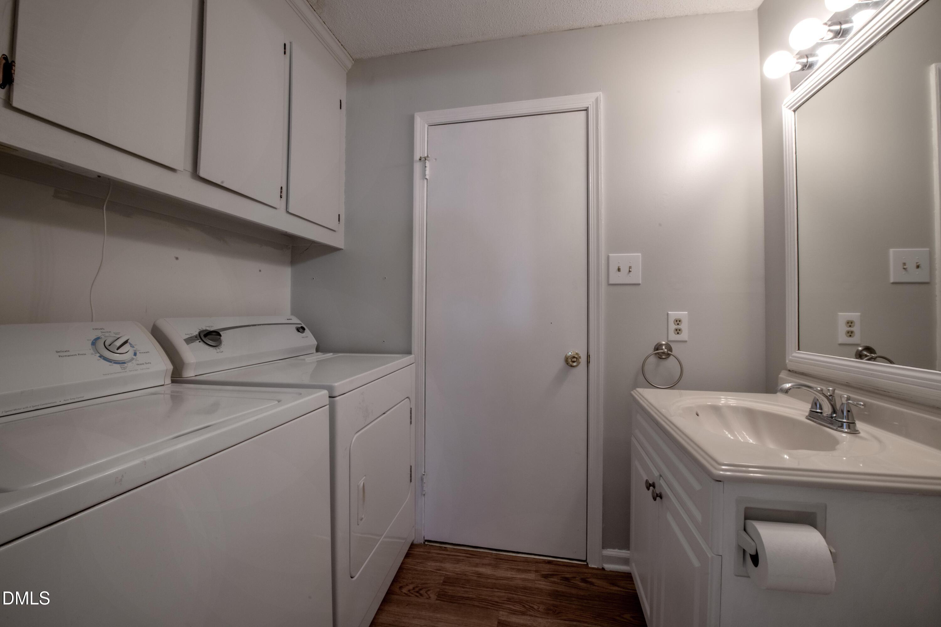 116 East Judd Street Zebulon, NC 27597 - Photo 12 of 21 a bathroom with a sink and a mirror