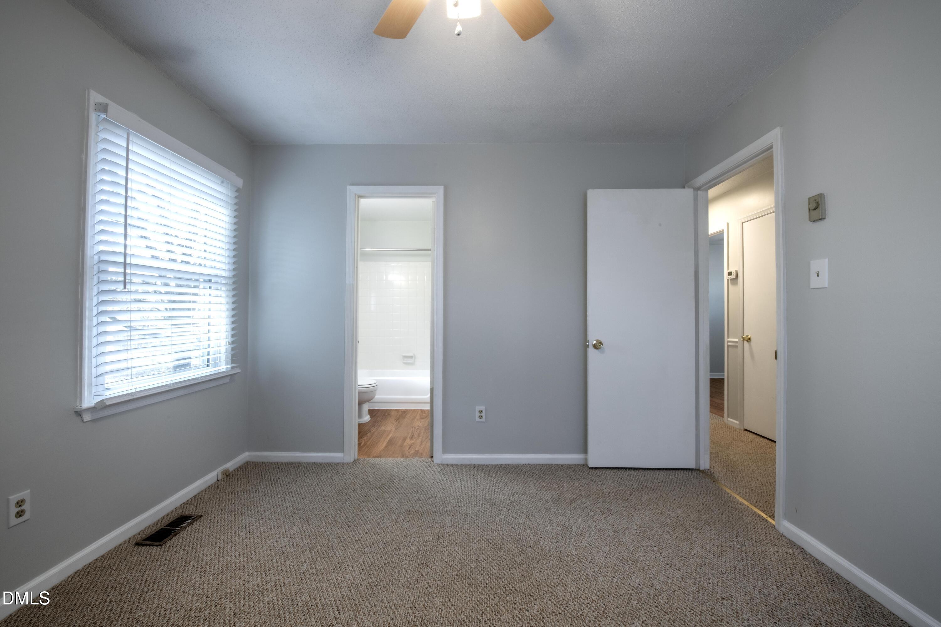 116 East Judd Street Zebulon, NC 27597 - Photo 14 of 21 an empty room that has a window