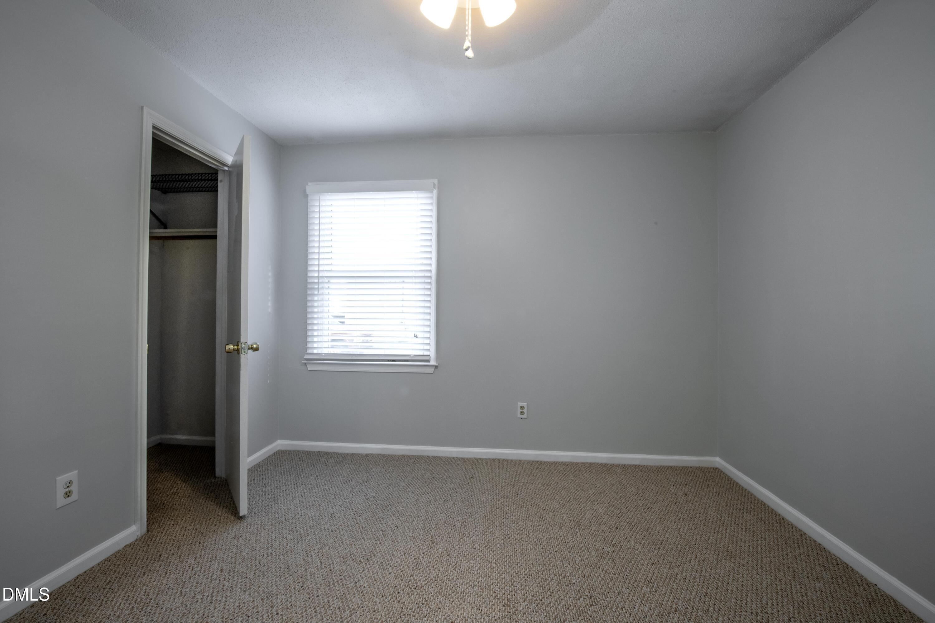 116 East Judd Street Zebulon, NC 27597 - Photo 15 of 21 an empty room with a window