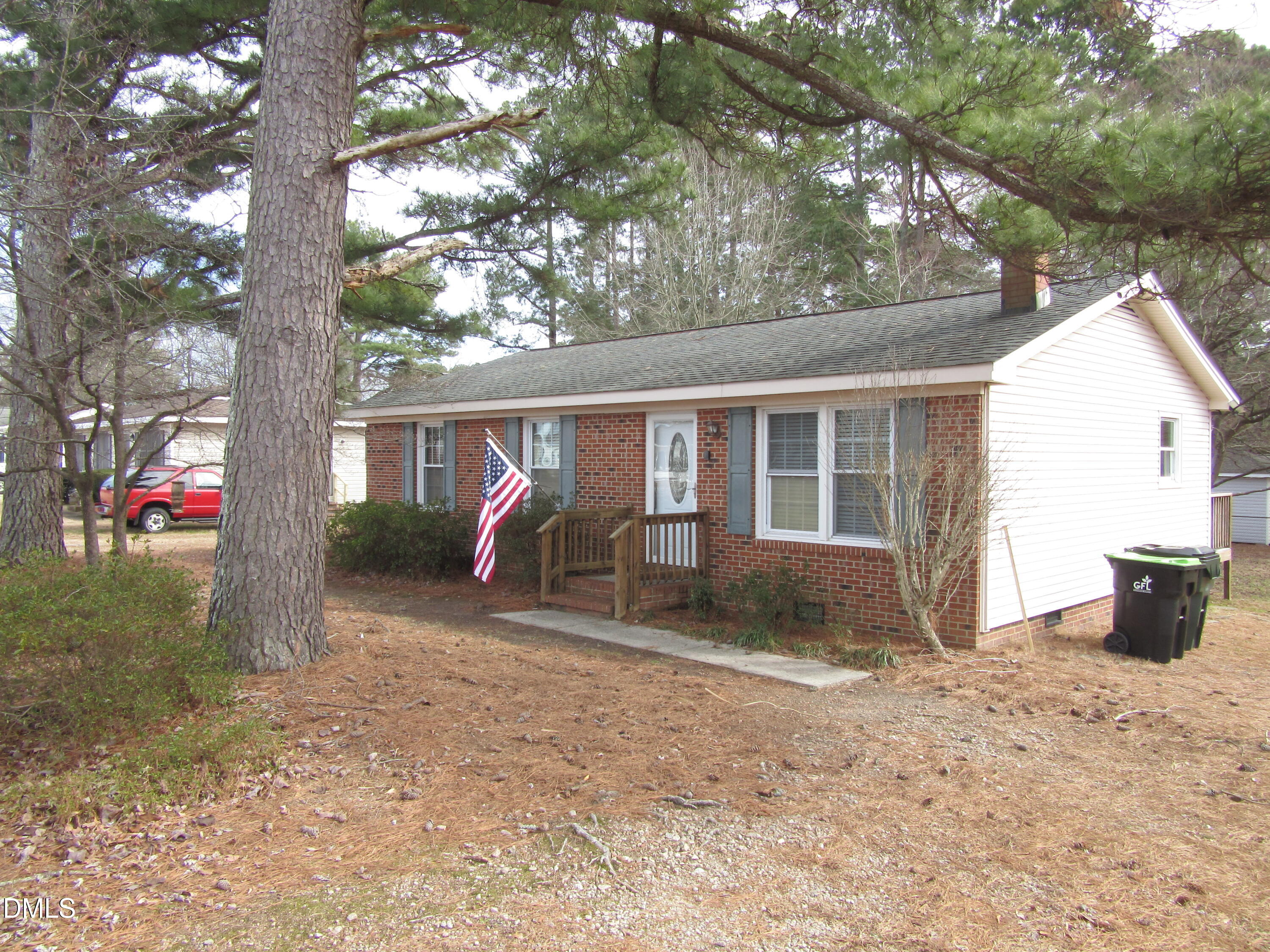116 East Judd Street Zebulon, NC 27597 - Photo 21 of 21 a view of a house with backyard porch and sitting area