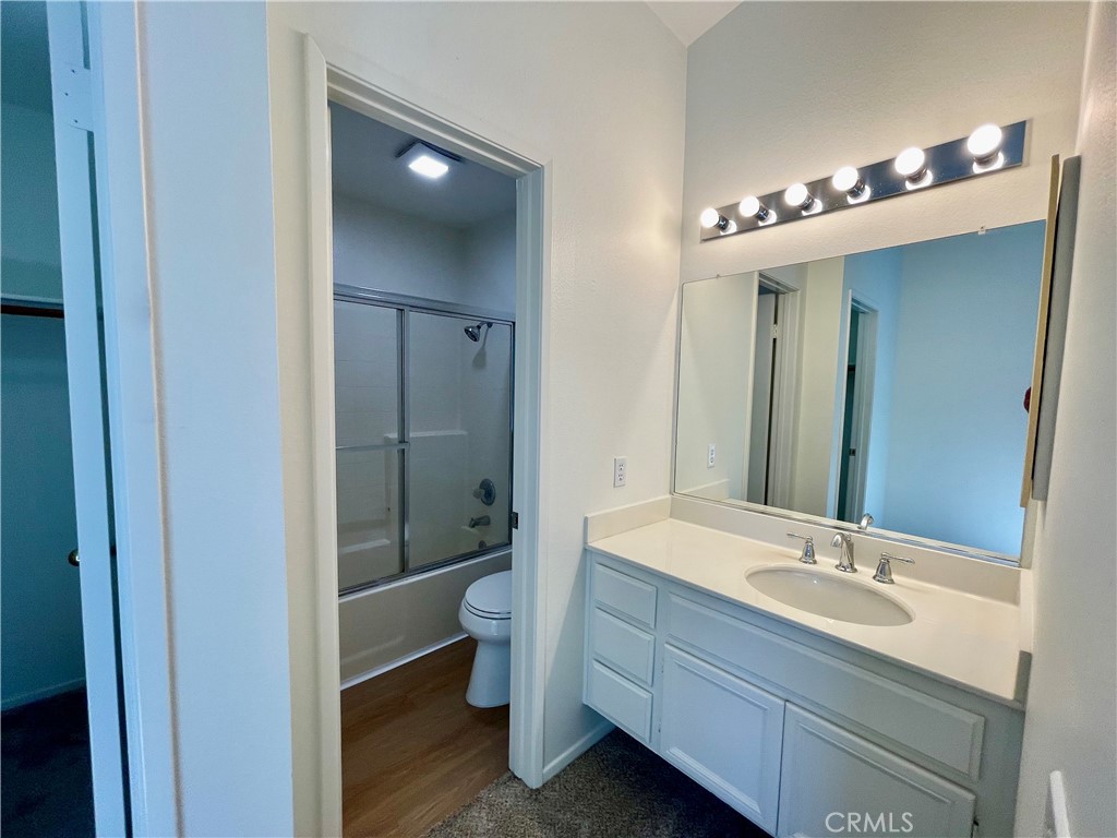 10 Chaumont Circle Lake Forest, CA 92610 - Photo 9 of 11 a bathroom with a double vanity sink mirror and toilet