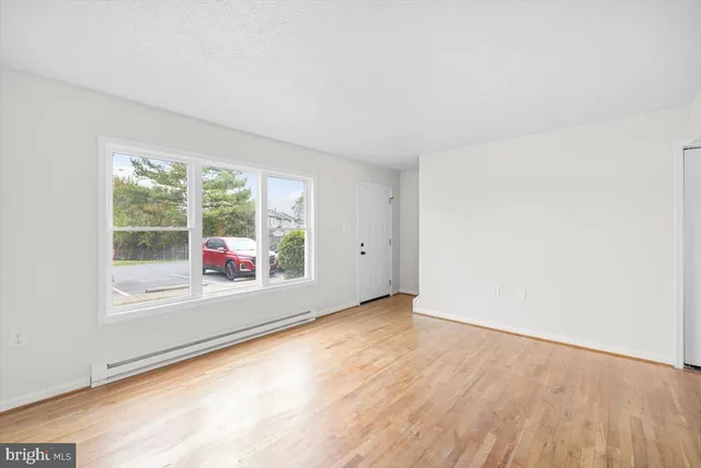 a kitchen with stainless steel appliances a refrigerator stove and microwave
